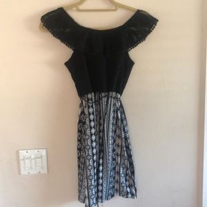Black off the shoulder dress with a pattern skirt